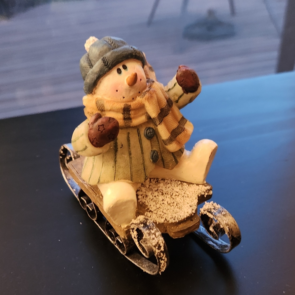 Sledding Snowman Figurine